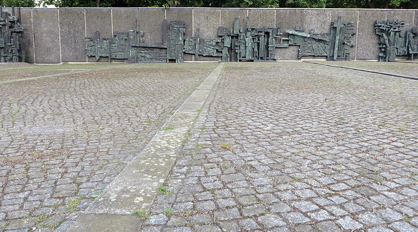 The stations of the Cross occupy a wall alongside the Maria Regina Martyrum church, Berlin