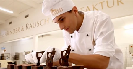 Chocolatier puts finishing touches to a mini torte, Fassbender & rausch factory, Berlin