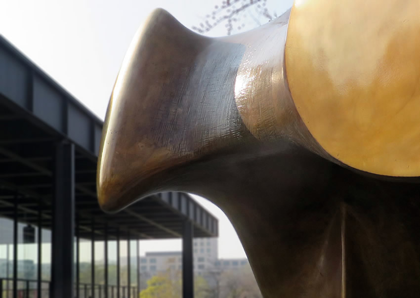 Henry Moore sculpture with Mies van der Rohe gallery in background, Berlin