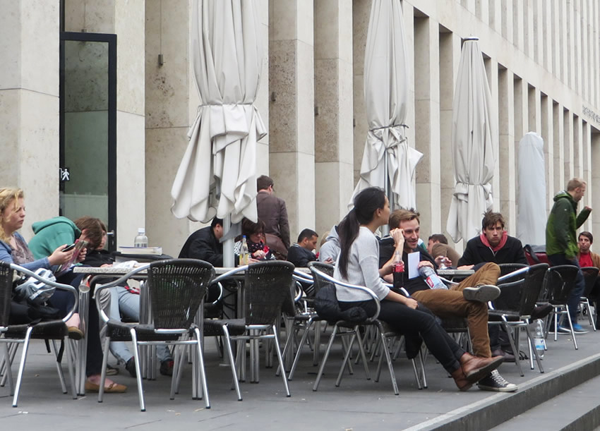 Students enjoy a snack outside the Jacob und Wilhelm Grimm Library, Berlin. The city's many university canteens are open to the public.